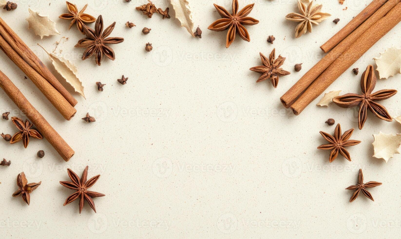 A white background with a variety of spices including cinnamon, cloves photo