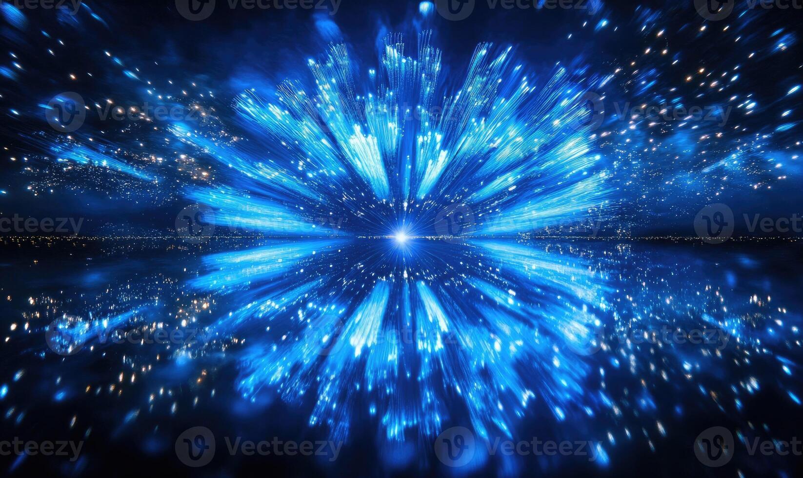 A blue explosion with a bright light in the middle photo