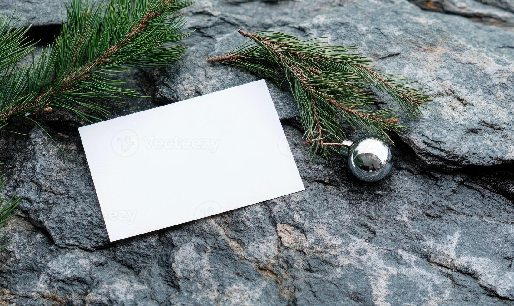 A white card with a silver ball on top of it photo