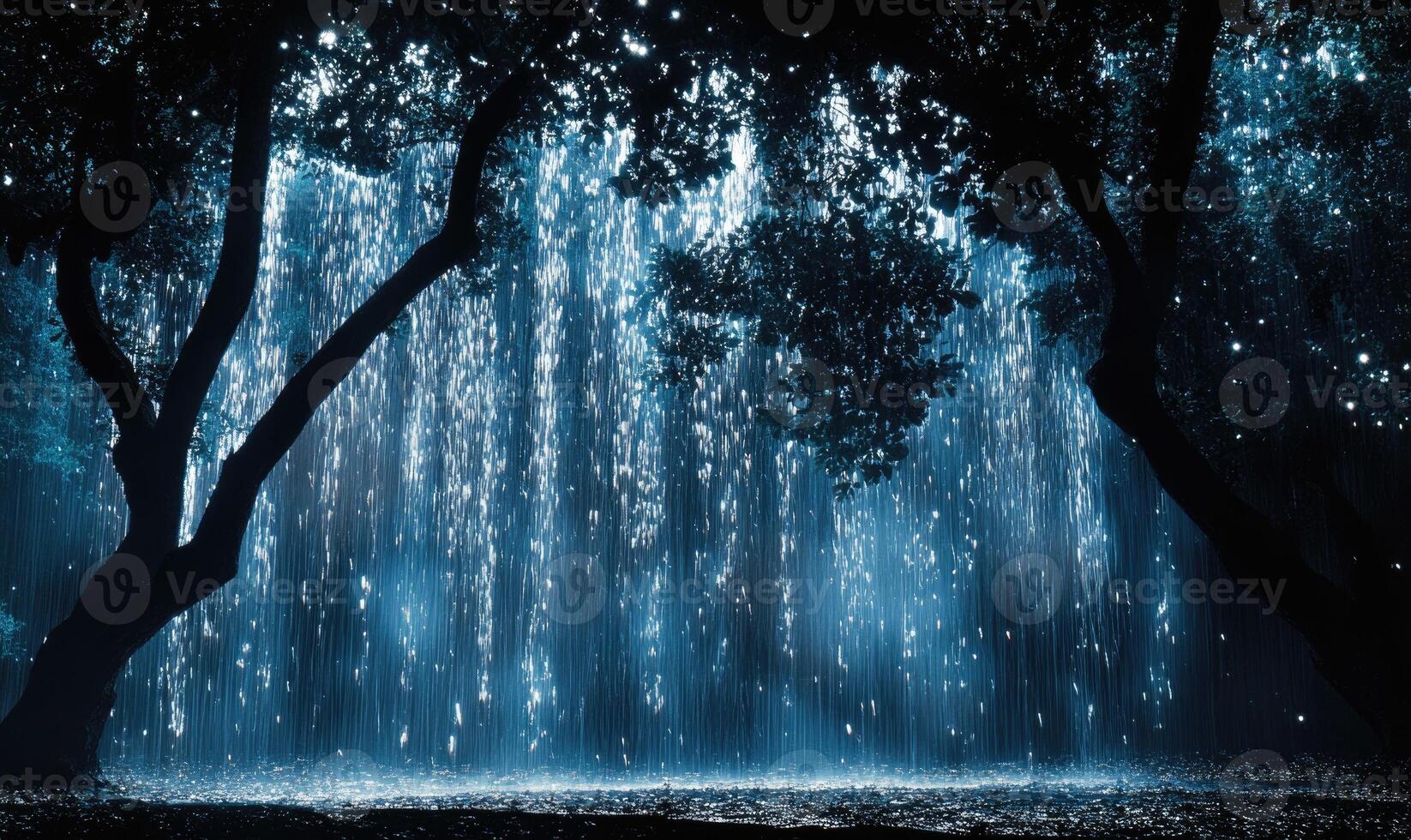 A forest with a waterfall and trees photo
