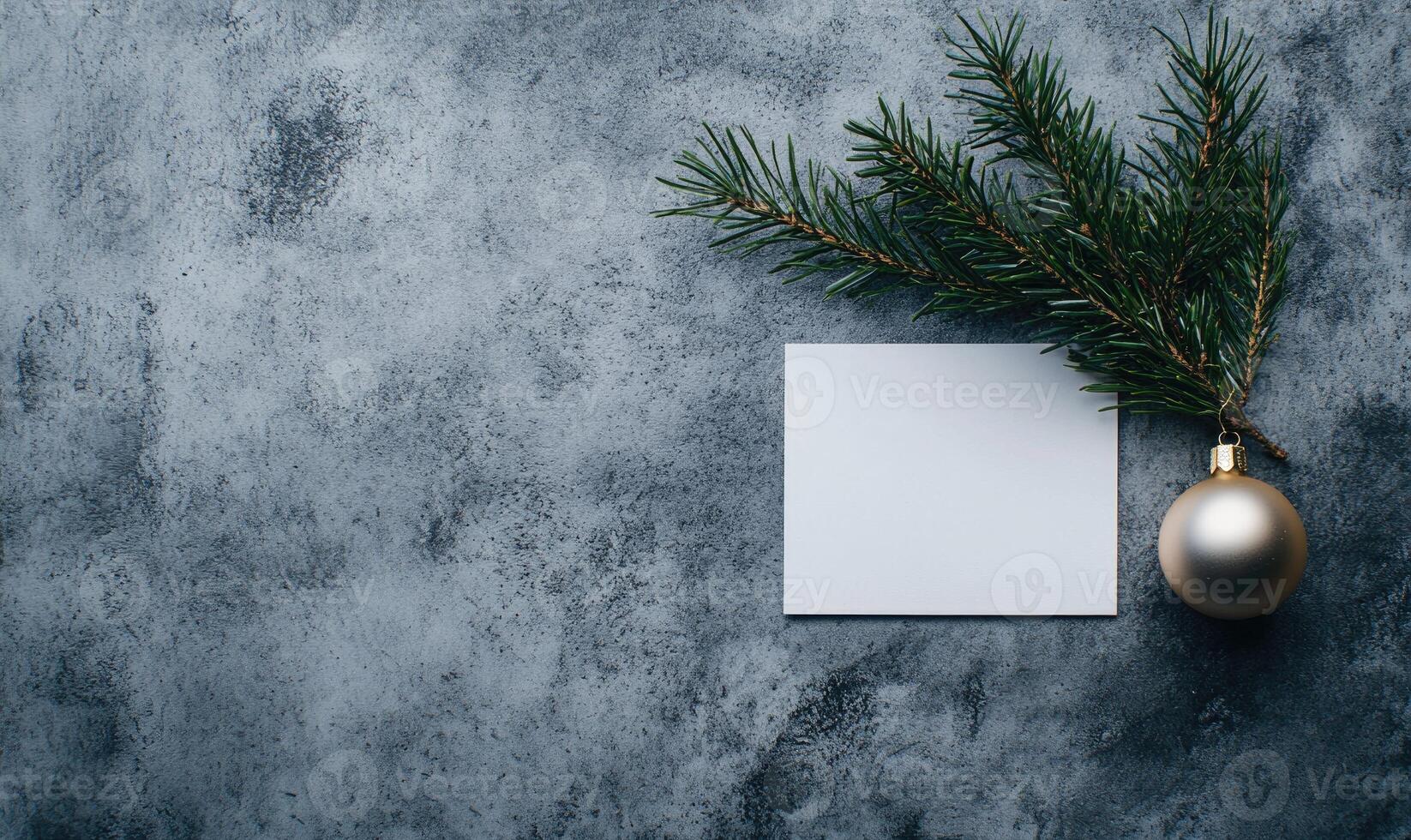 A white card with a gold ornament on top of it photo