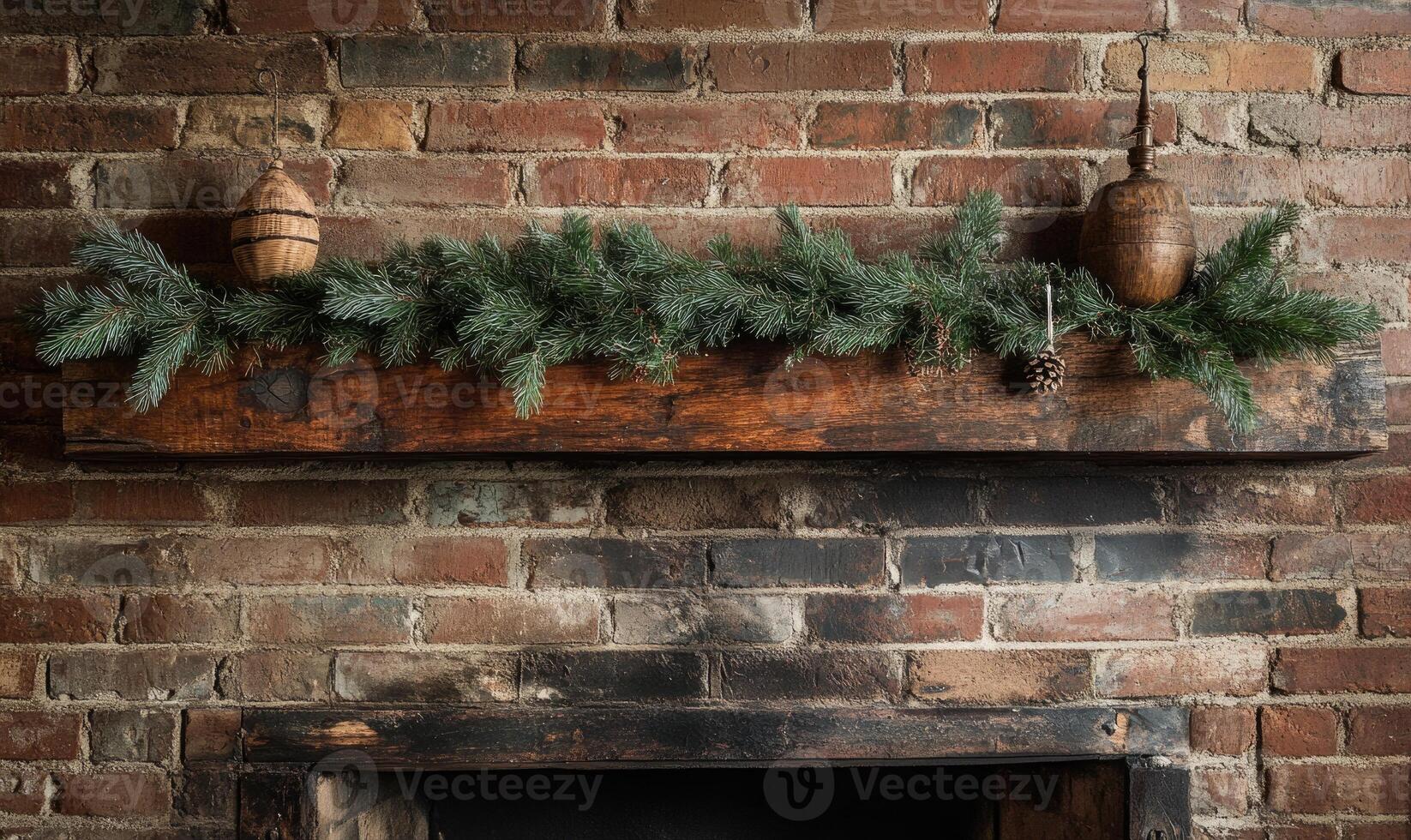 A brick fireplace mantle with a pine tree wreath and pine cones on it photo