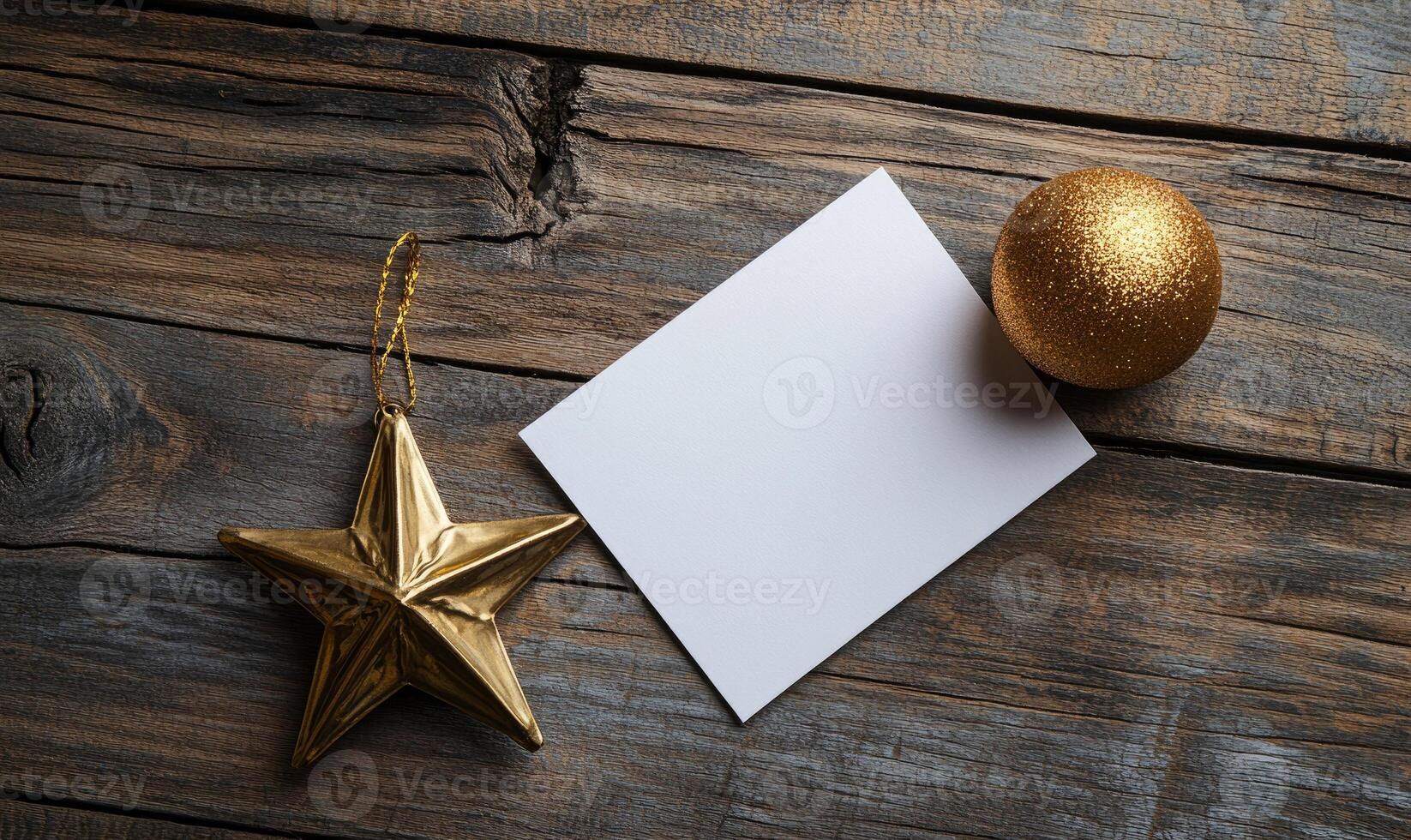 A gold star sits on a wooden surface next to a white card photo