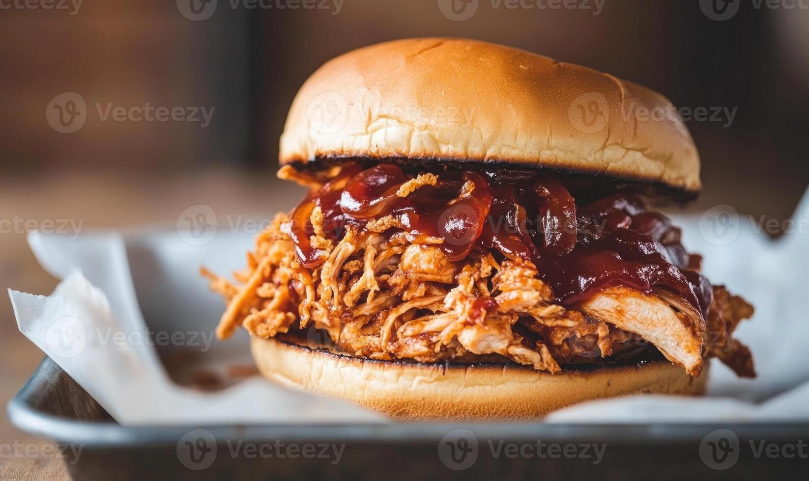 A large sandwich with barbecue sauce on it photo