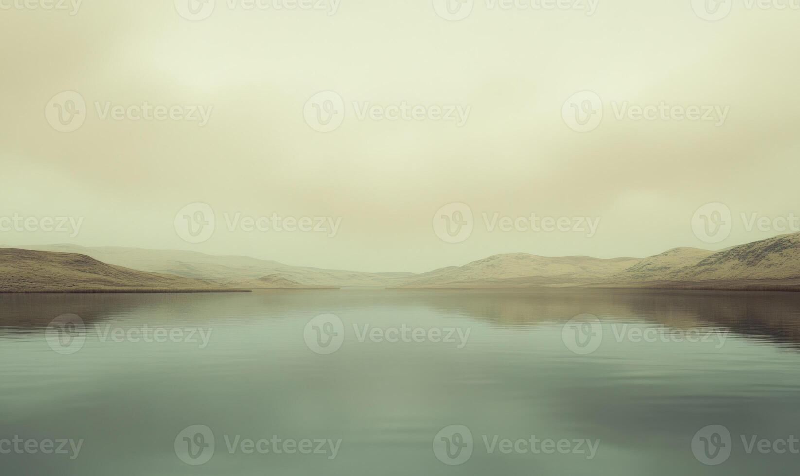 A calm lake with a cloudy sky in the background photo
