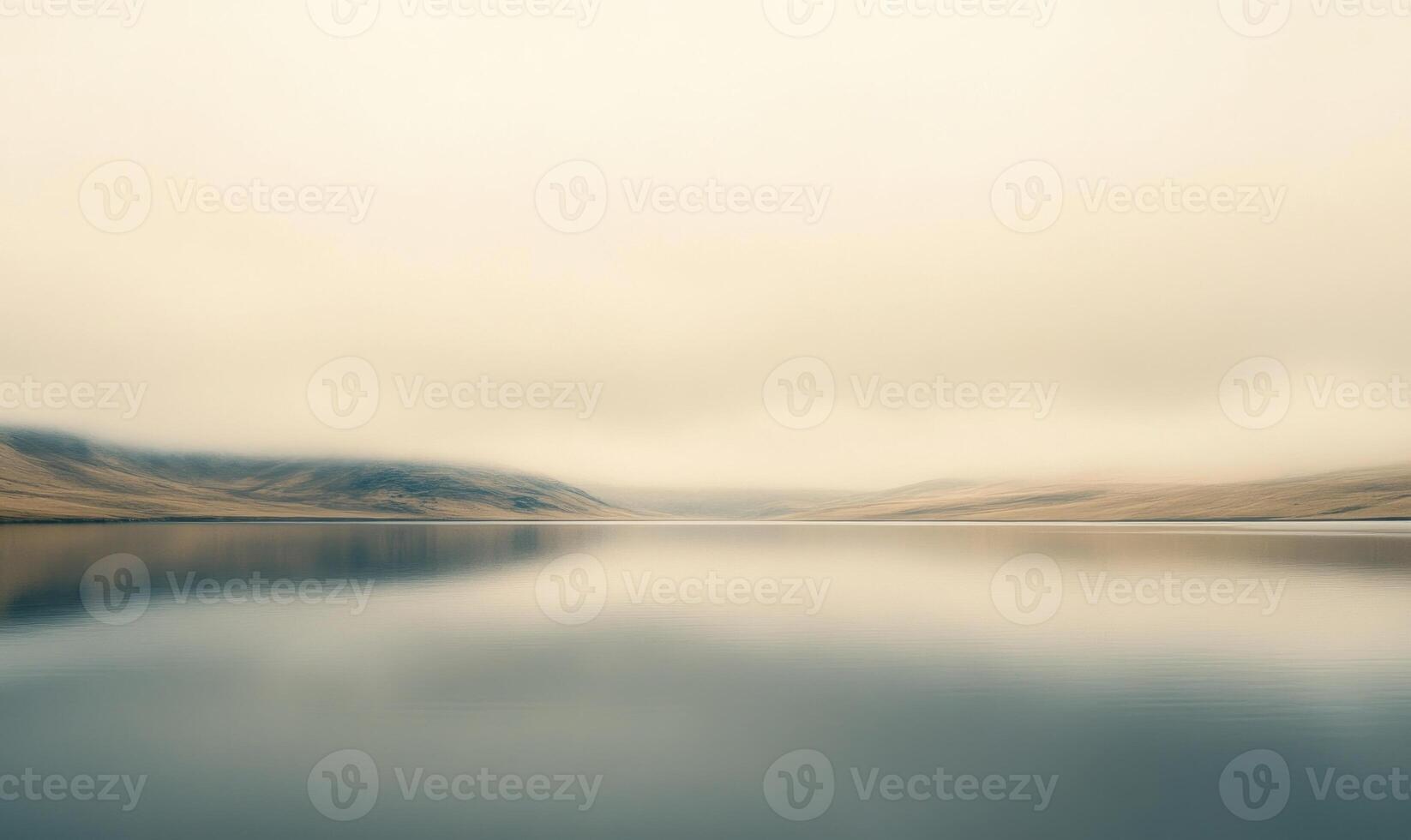 A cloudy sky with a lake in the background photo