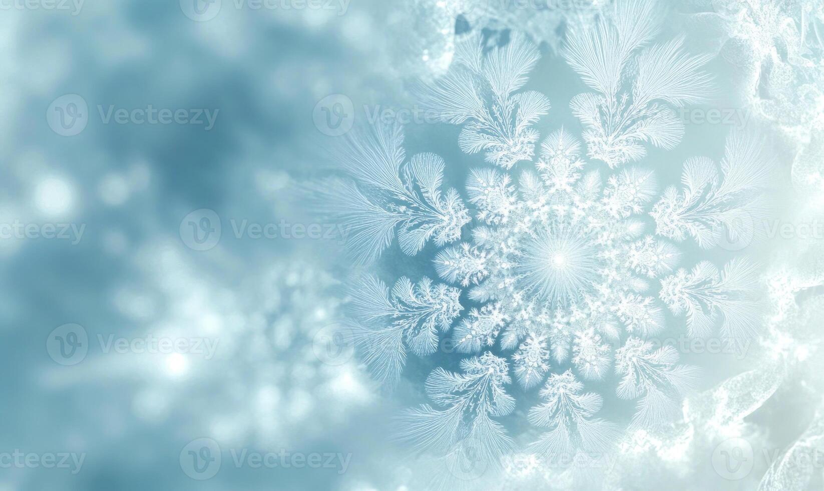 A snowflake is the main focus of the image, with a blue background photo
