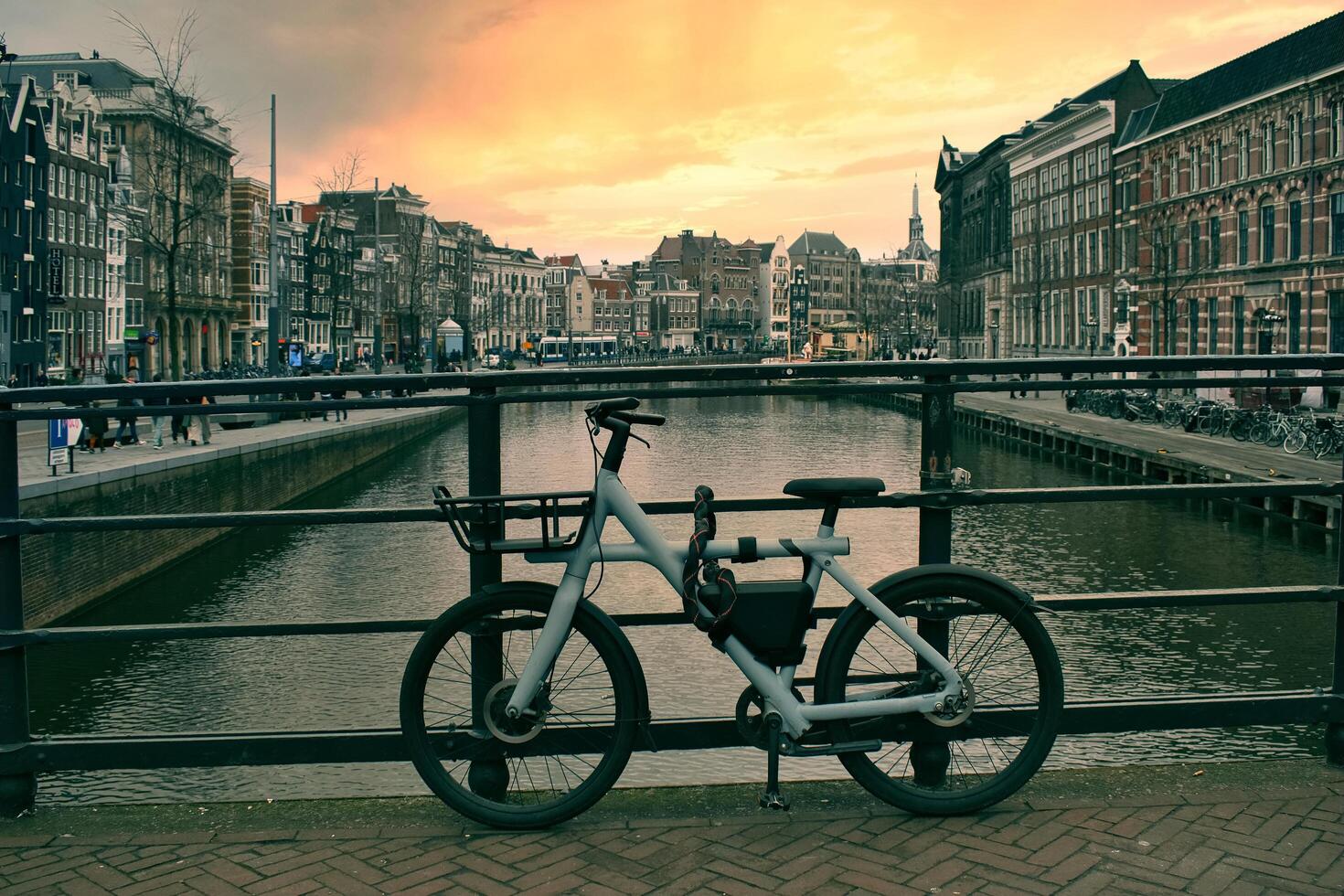 A bike is parked on a bridge photo