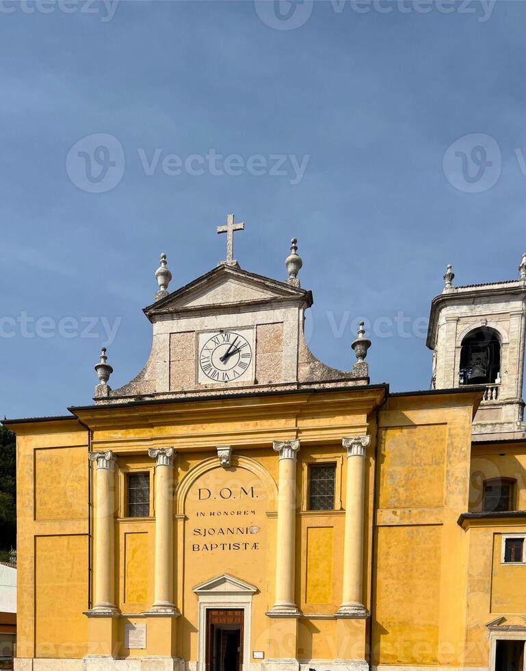 Church of Saint John Baptist in Cavaion Veronese VR, Italy. Historical architecture with a clock on the facade, classic Italian style photo