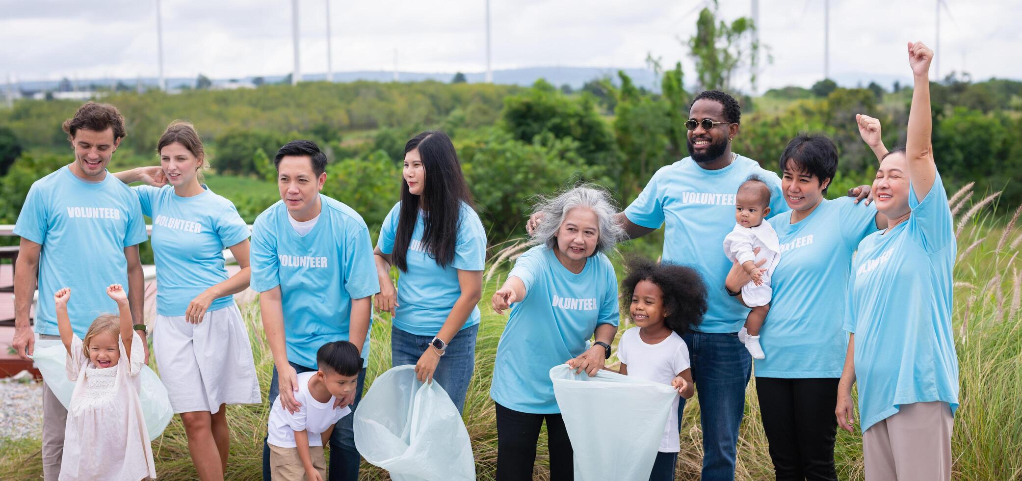 group of people wearing blue shirts with the word volunteer on them photo