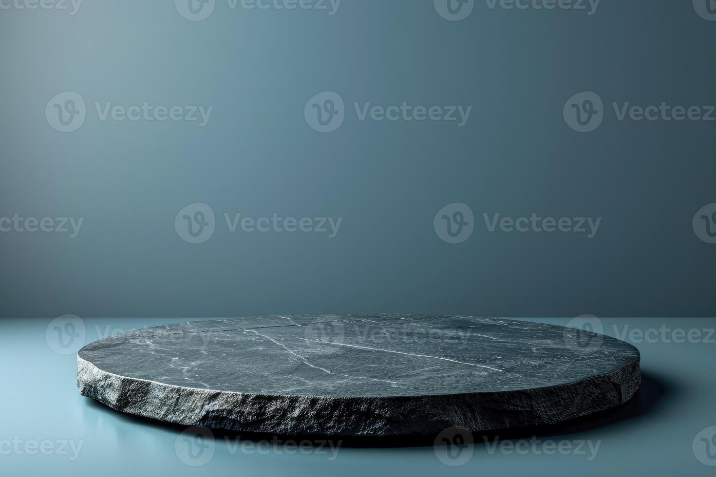 Empty black stone table top, desk or shelf isolated on dark pale blue background photo
