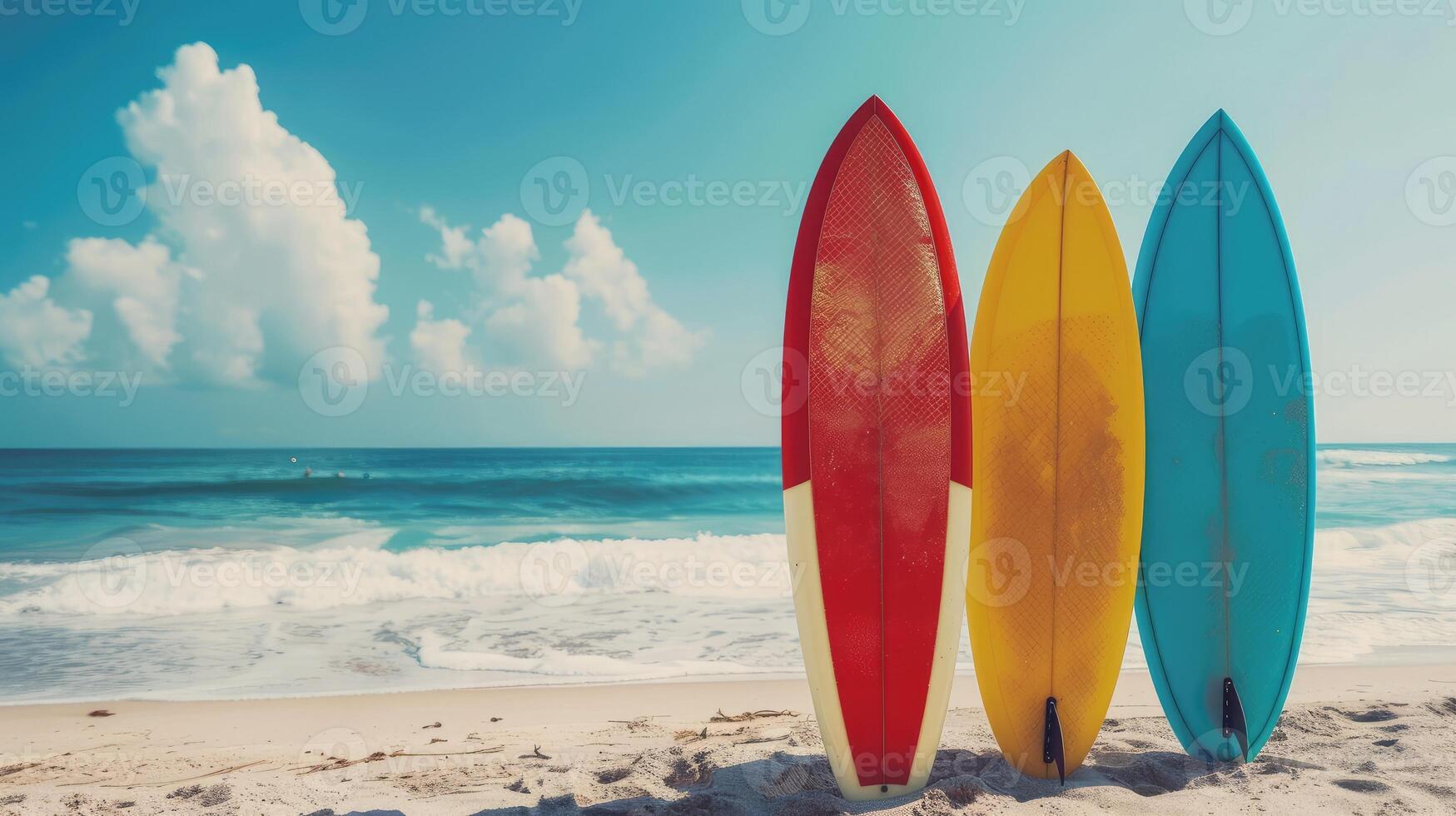 Colorful surfboards standing on a beautiful beach in summer time photo