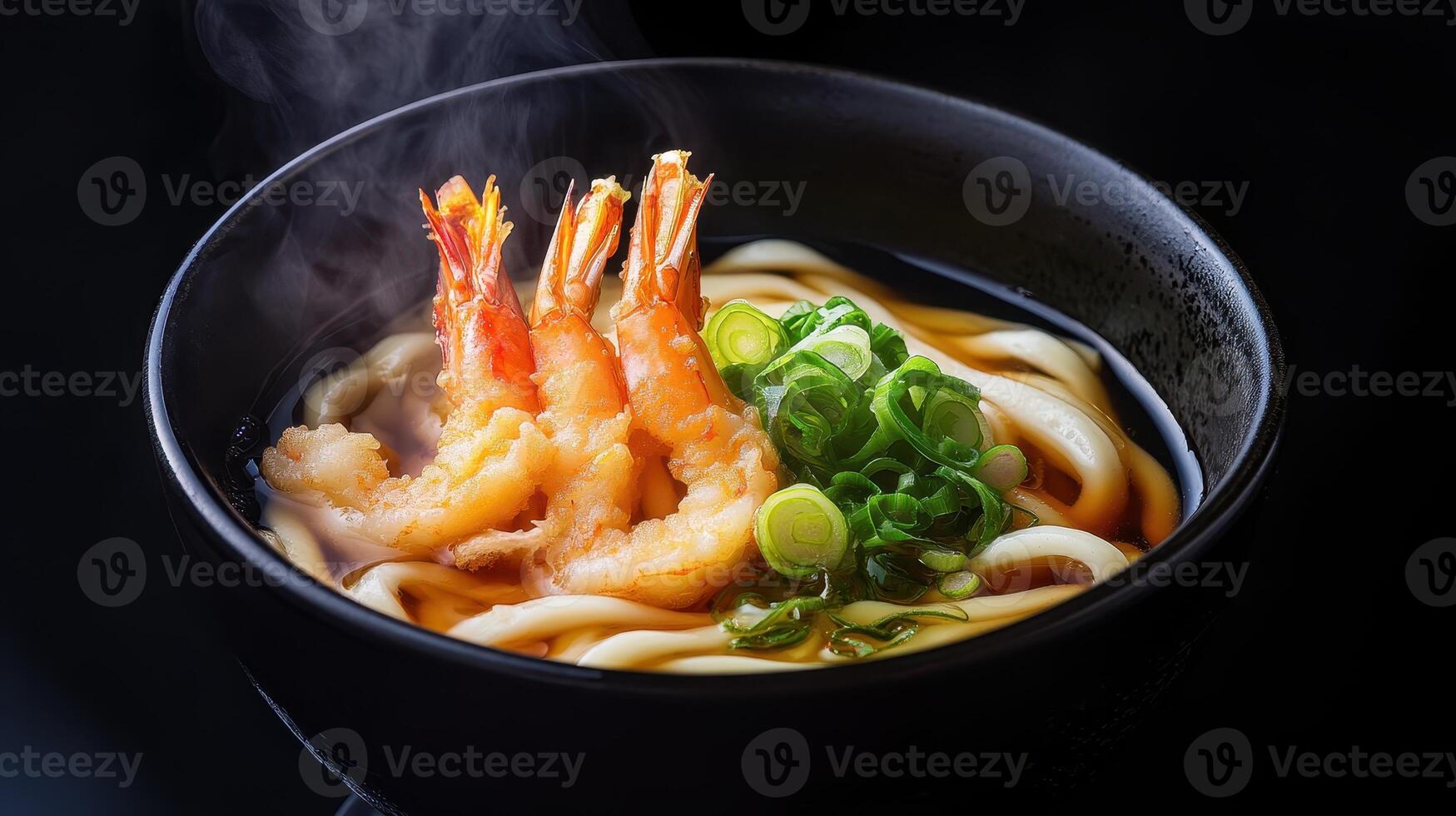 Japanese udon noodle soup with shrimps on table photo