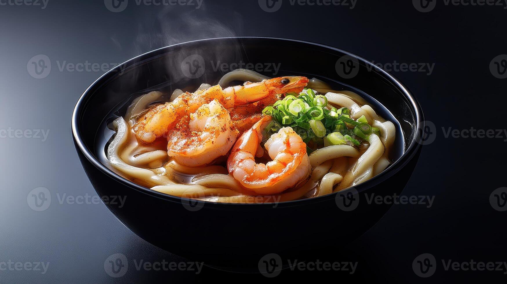 Japanese udon noodle soup with shrimps on table photo