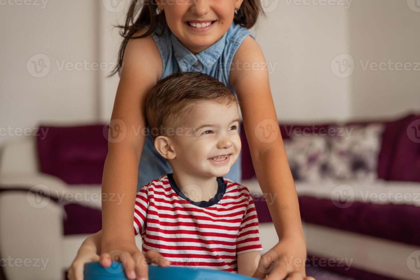 Happy children have fun together while playing at home. photo