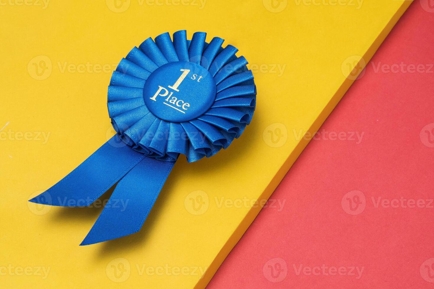 Rosette first place for the achievement and success of the winner on an illuminating background photo
