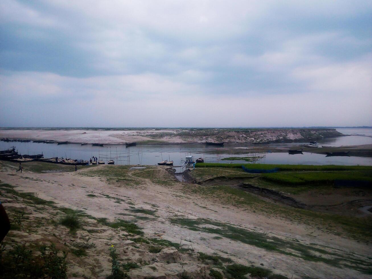 A view of a river and a boat on the water photo