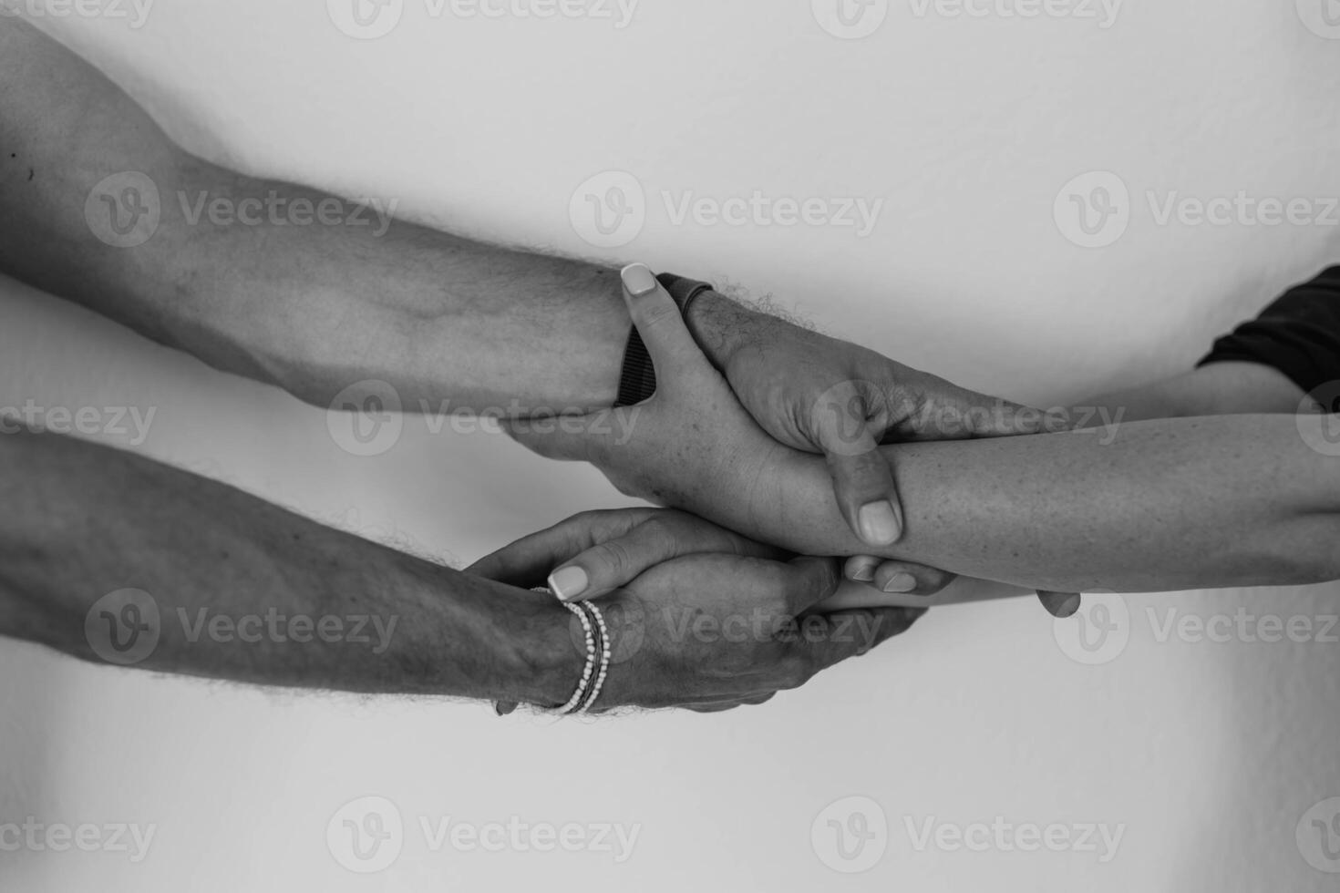 Two hands hold tightly to each other, rescuer saves, pulls out of trouble a person in need of help photo