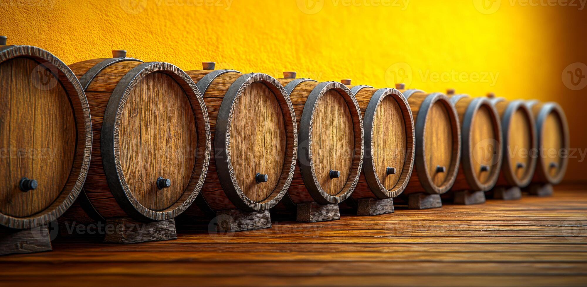 A row of wooden barrels are lined up on a wooden floor. The barrels are all the same size and shape, and they are all brown. The scene gives off a rustic and traditional vibe photo