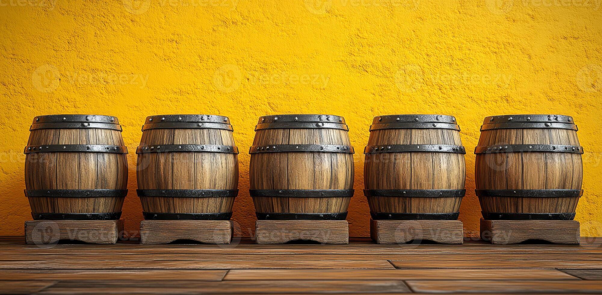 Five barrels of wood are lined up against a yellow wall. The barrels are all different sizes and are made of wood. The scene has a rustic and cozy feel to it photo