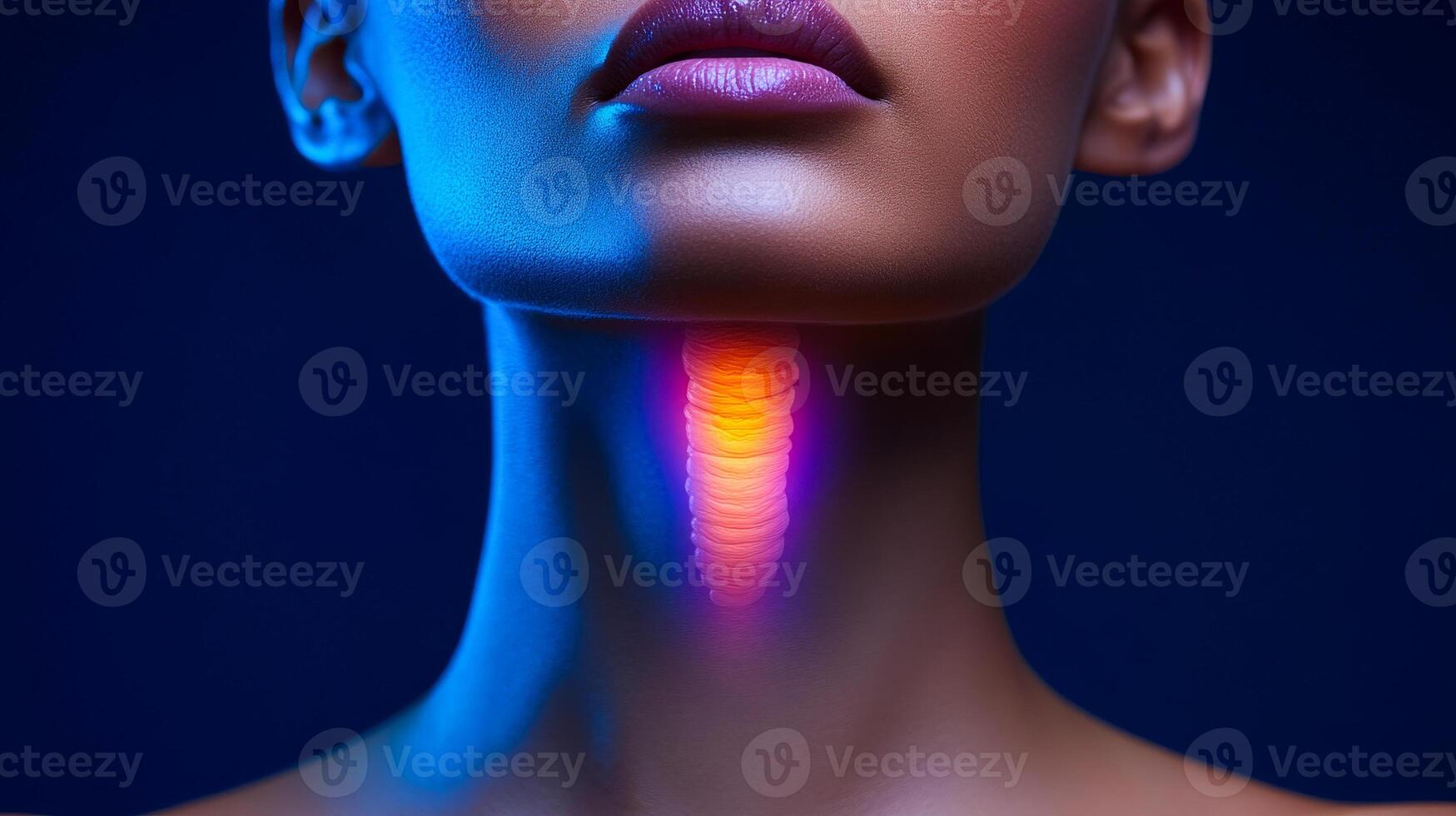 A woman's neck is glowing in the dark blue background. The neck is the main focus of the image, and the glowing effect adds a sense of mystery and intrigue to the scene photo