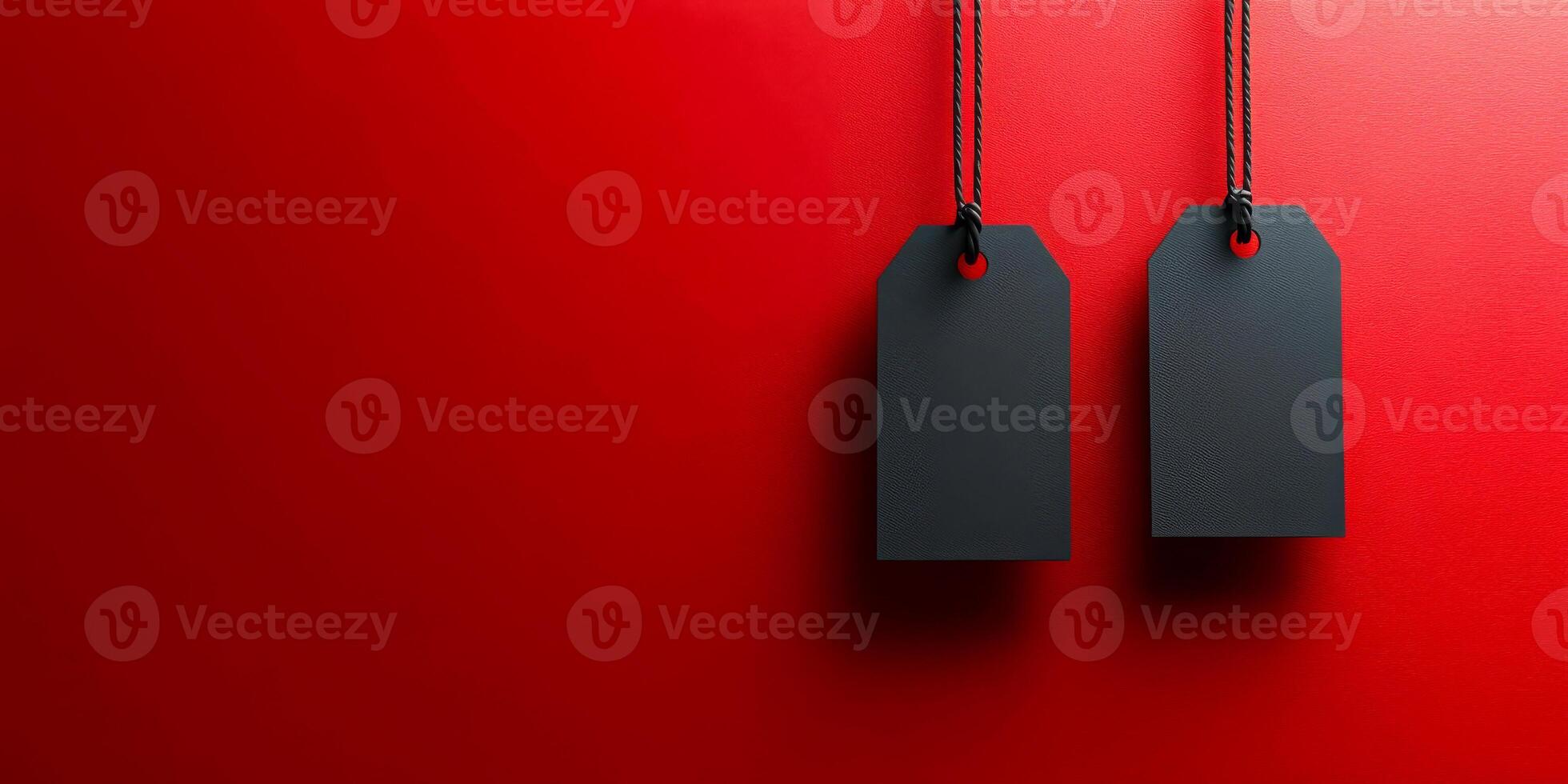 Two tags are hanging from a red background photo