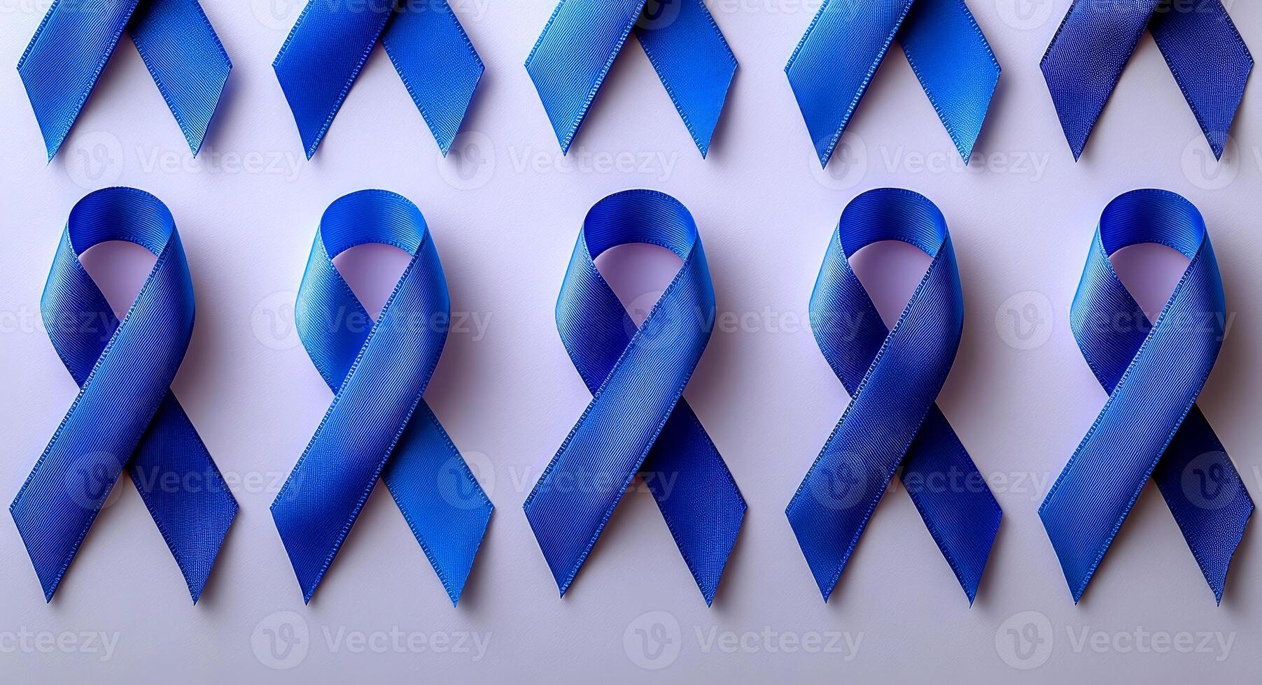 A series of blue ribbons are arranged in a row on a white background. The ribbons are likely meant to represent a cause or support for a specific issue, such as breast cancer awareness photo
