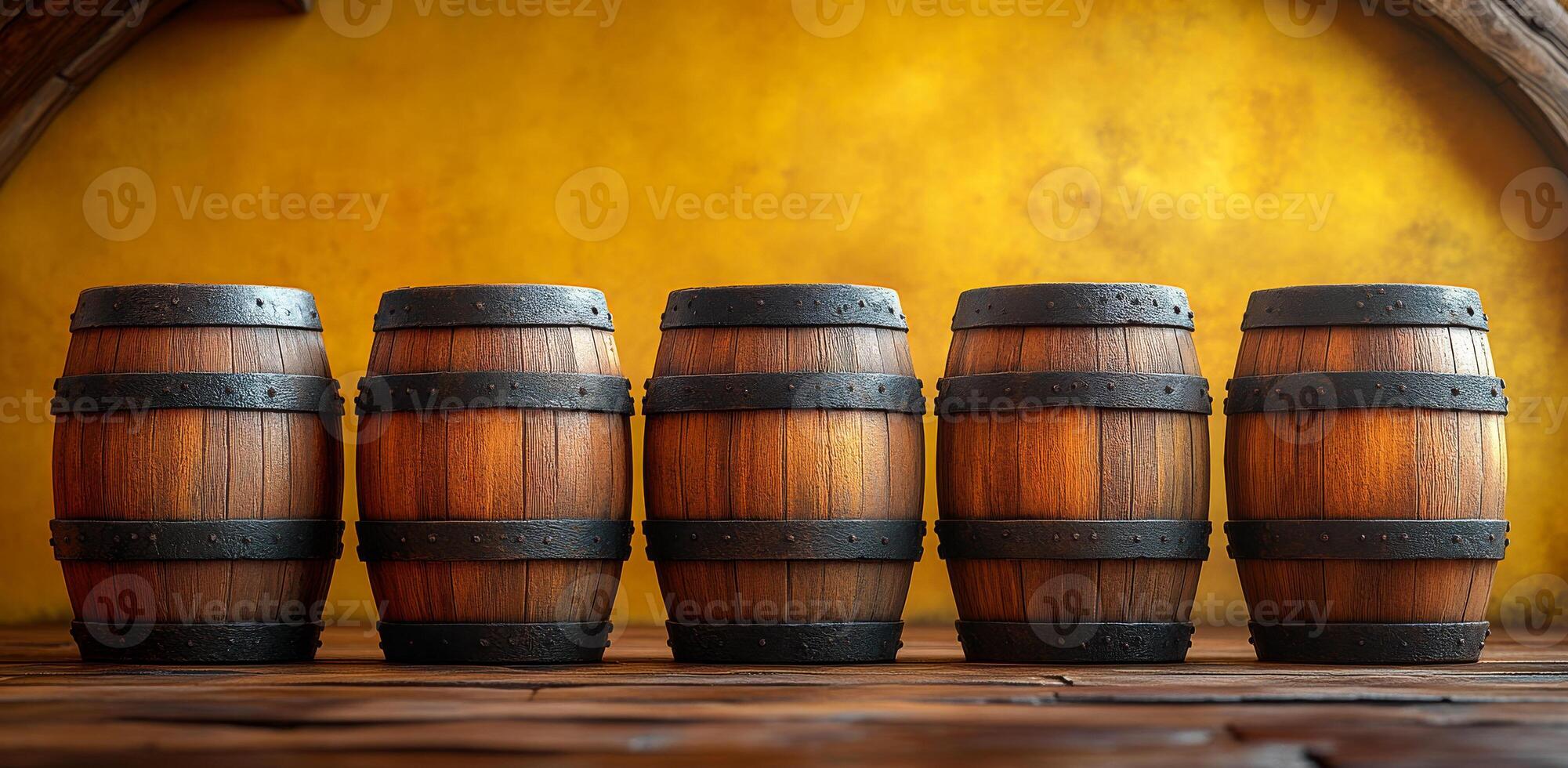 A row of five wooden barrels are lined up on a wooden floor. The barrels are all the same size and shape, and they are all brown. The scene has a rustic and traditional feel photo