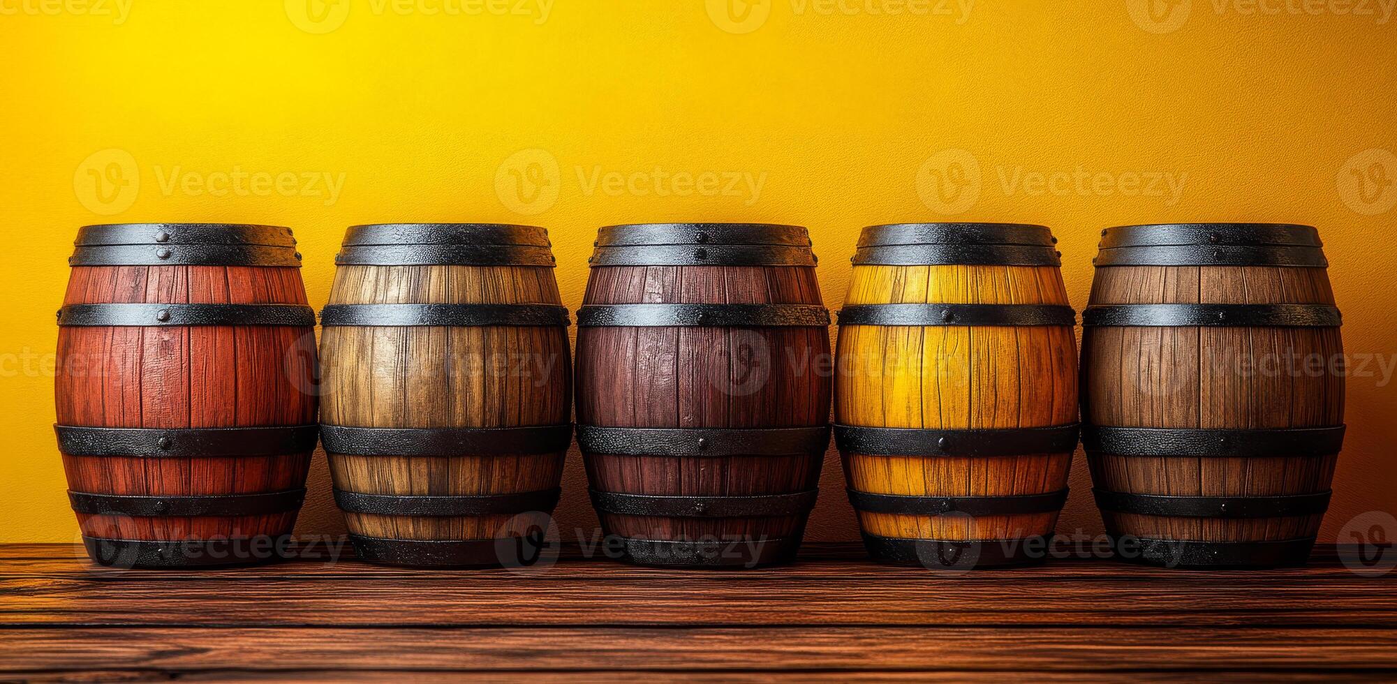 A row of wooden barrels with different colors and sizes. The barrels are arranged on a wooden shelf photo