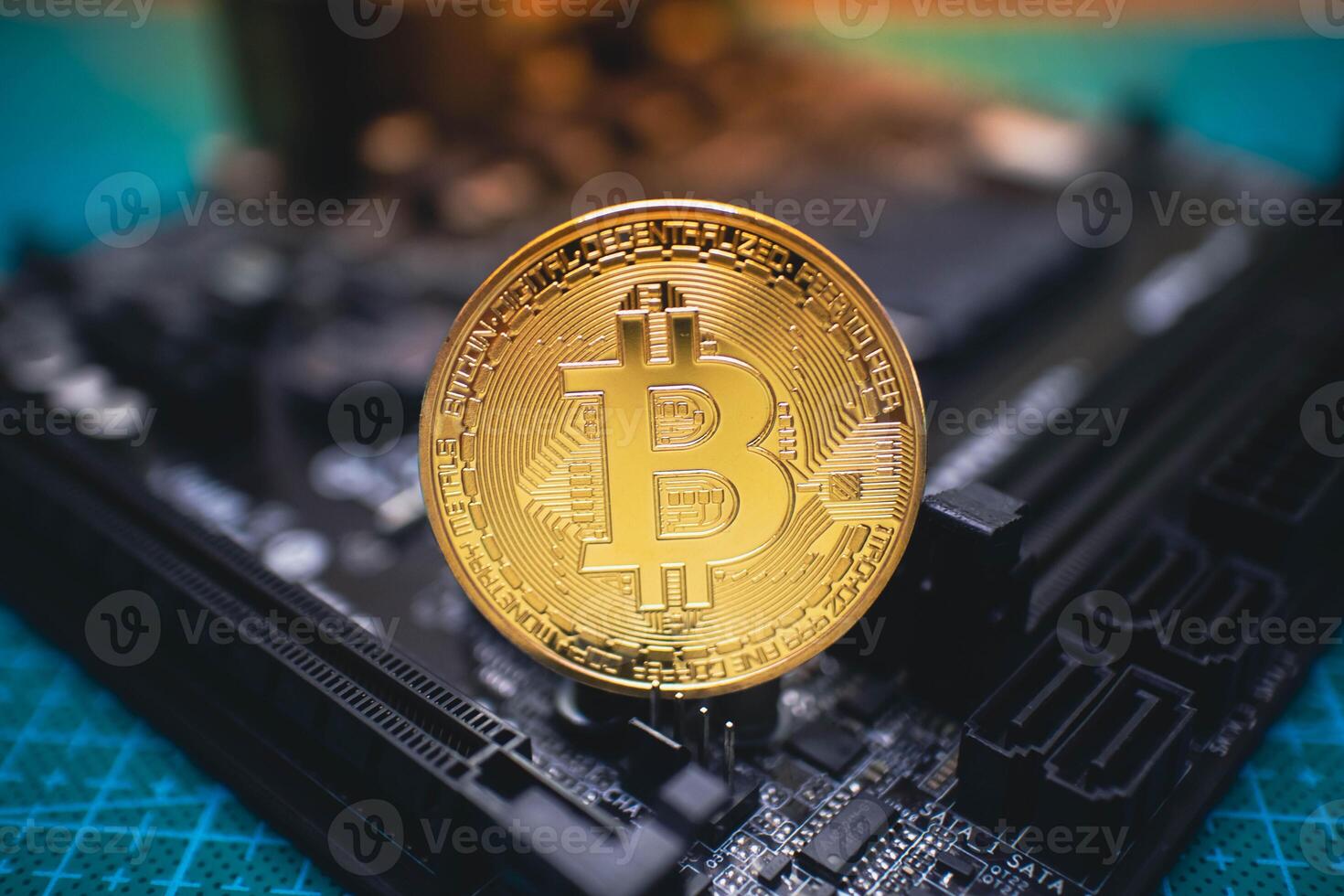 Golden Bitcoin Coin Standing on Circuit Board. photo