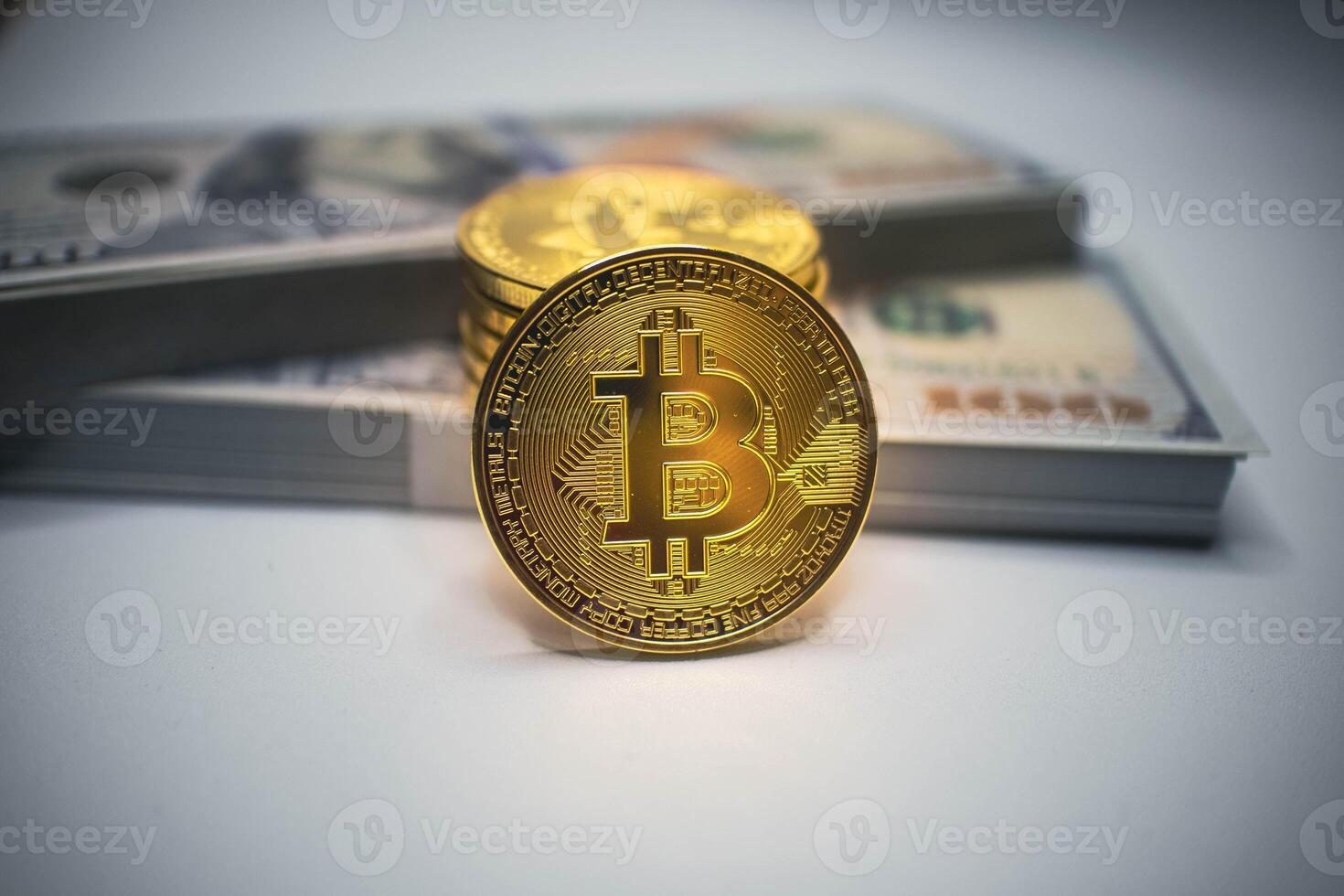Golden Bitcoin Coin with US Dollar Bills in the Background. photo