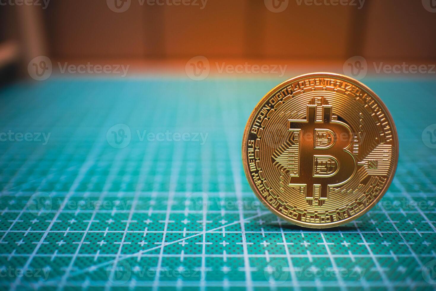 Golden Bitcoin on Green Grid Surface, Cryptocurrency Concept. photo