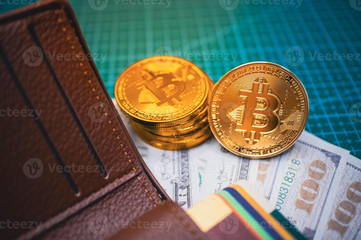 Golden Bitcoin Coins in Brown Wallet with US Dollars, Cryptocurrency Concept. photo