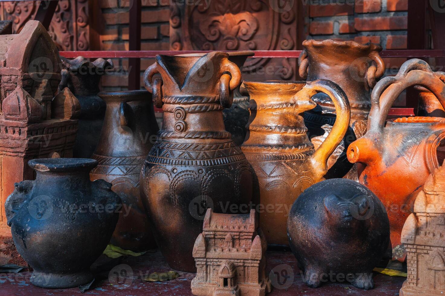 Antique clay pots, vases and jugs in pottery workshop in Vietnam in Asia photo
