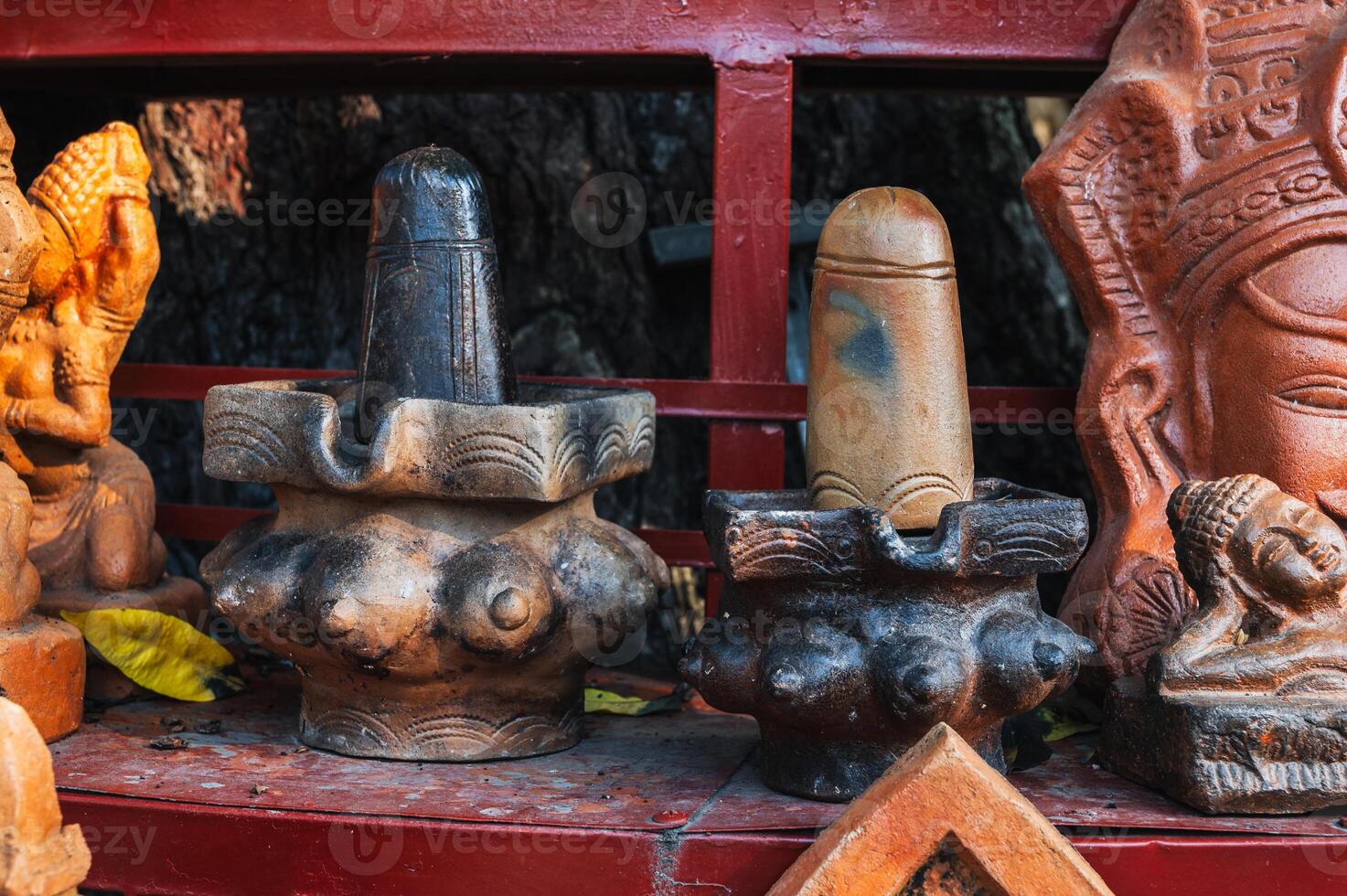 Clay figurines and statues of lingam in souvenir shop in Vietnam in Asia photo