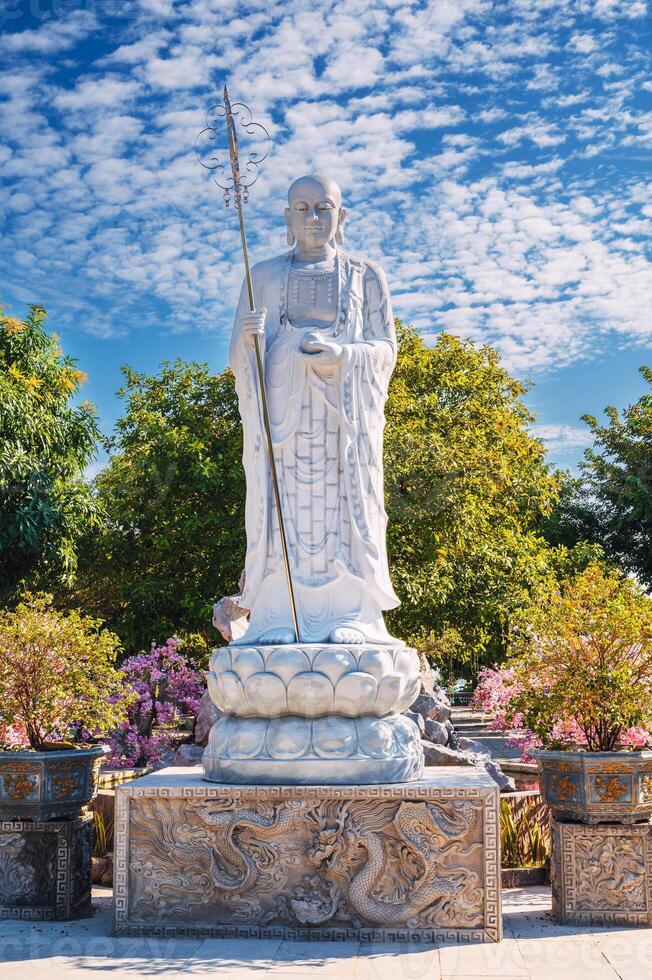 white Buddhist Buddha statue in park at Linh Ung Pagoda in Da Nang in Vietnam in summer in Asia photo