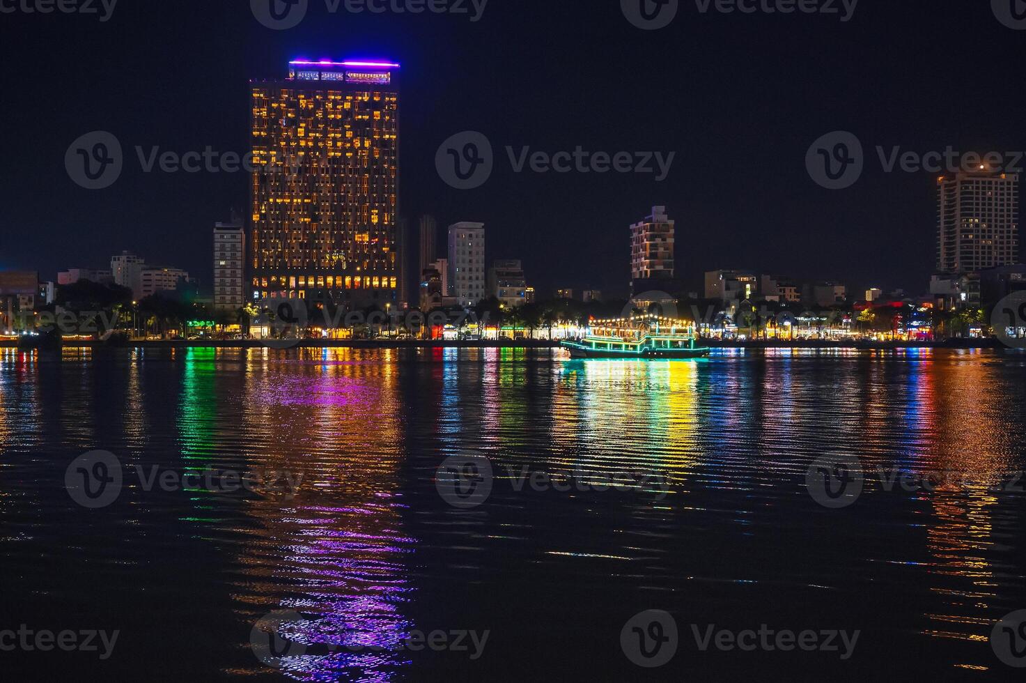 Night panorama of the Han River embankment and skyscrapers in Da Nang in Vietnam at night photo