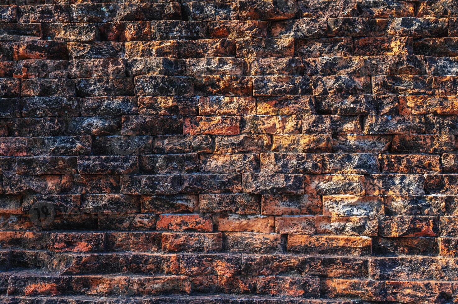 texture of ancient antique brick wall of historical old temple in Asia in close-up photo