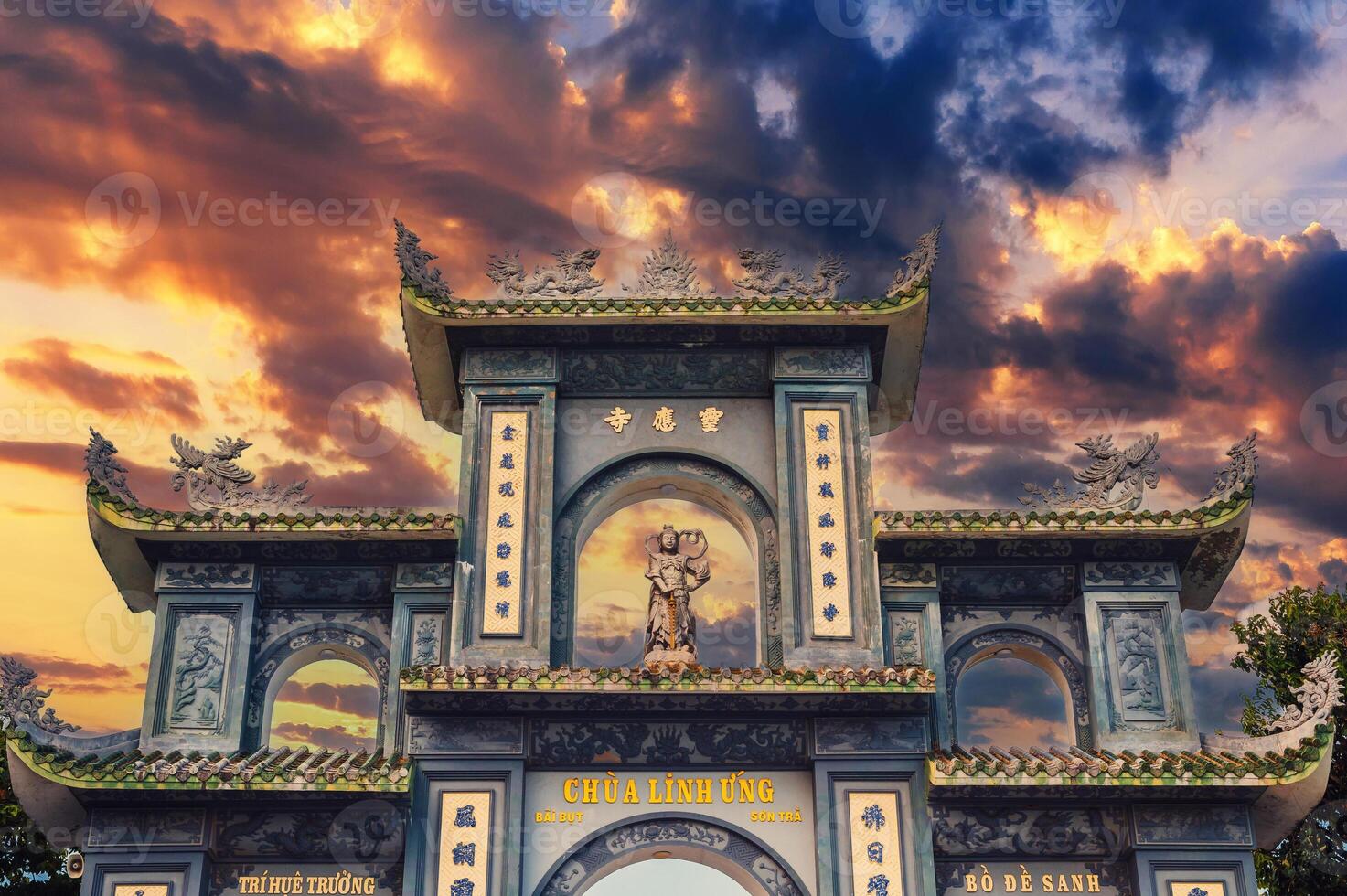 gate at Linh Ung Buddhist pagoda near statue of Lady Buddha in Da Nang in Vietnam in Asia at sunset photo