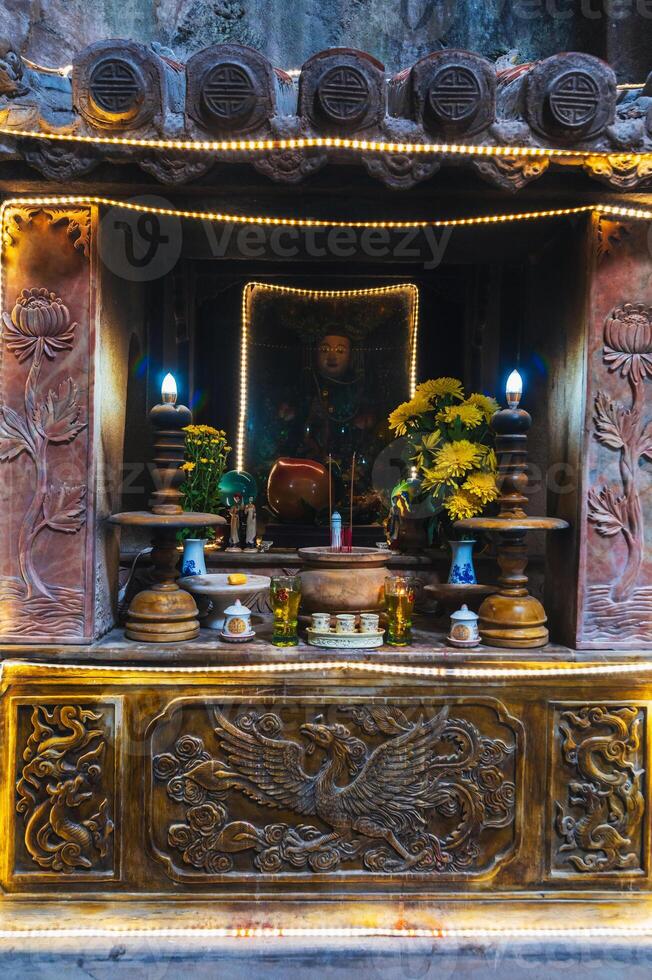 Buddhist temple with sanctuary inside Huyen Khong Cave in the Marble Mountains in Da Nang in Vietnam photo