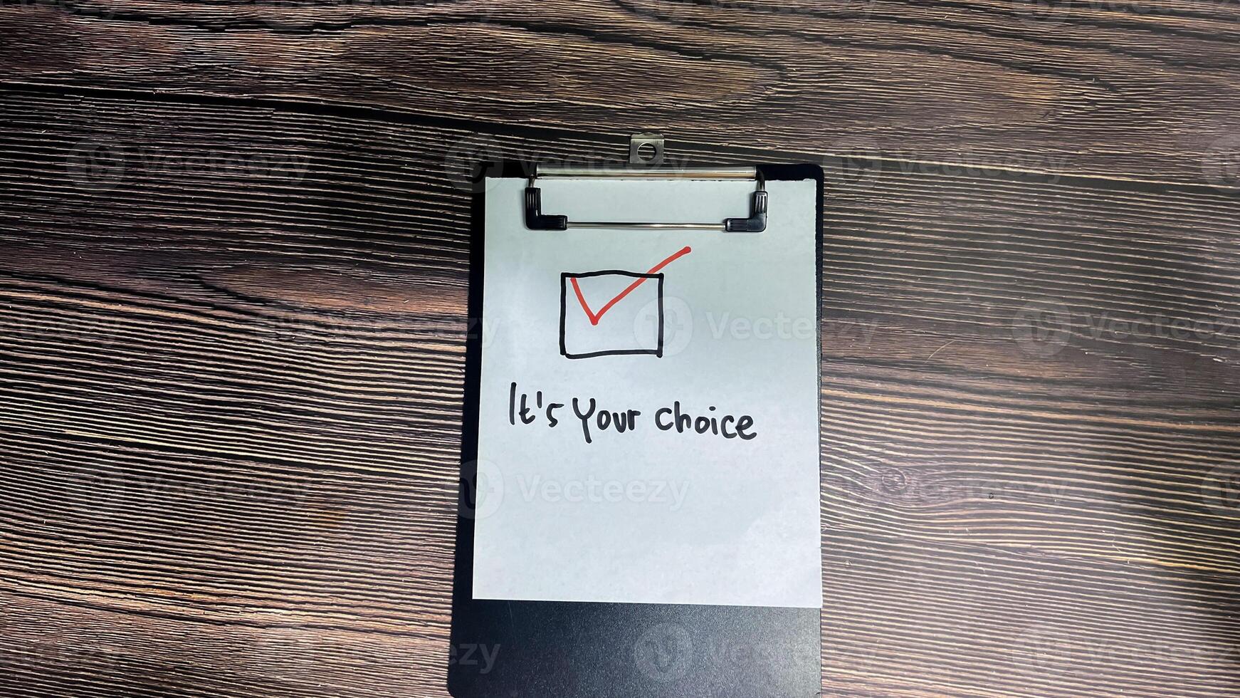 Concept of It's your choice write on paperwork isolated on wooden background. photo