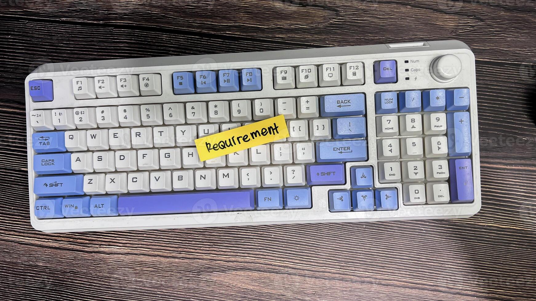 Concept of Requirement write on sticky notes isolated on Wooden Table. photo