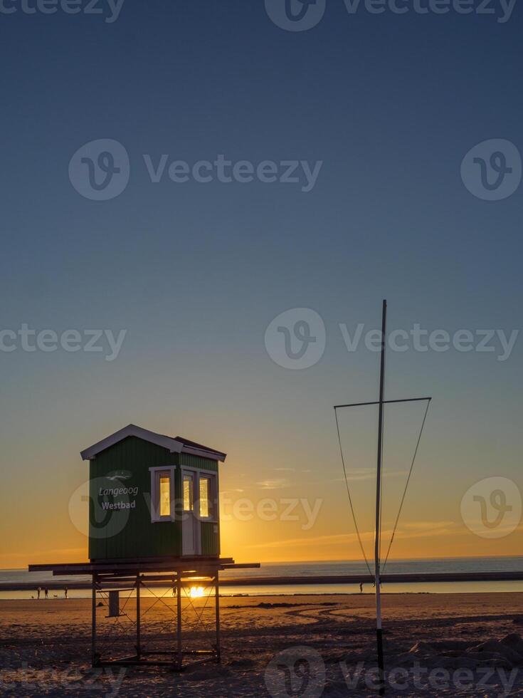 A lifeguard tower on the beach photo