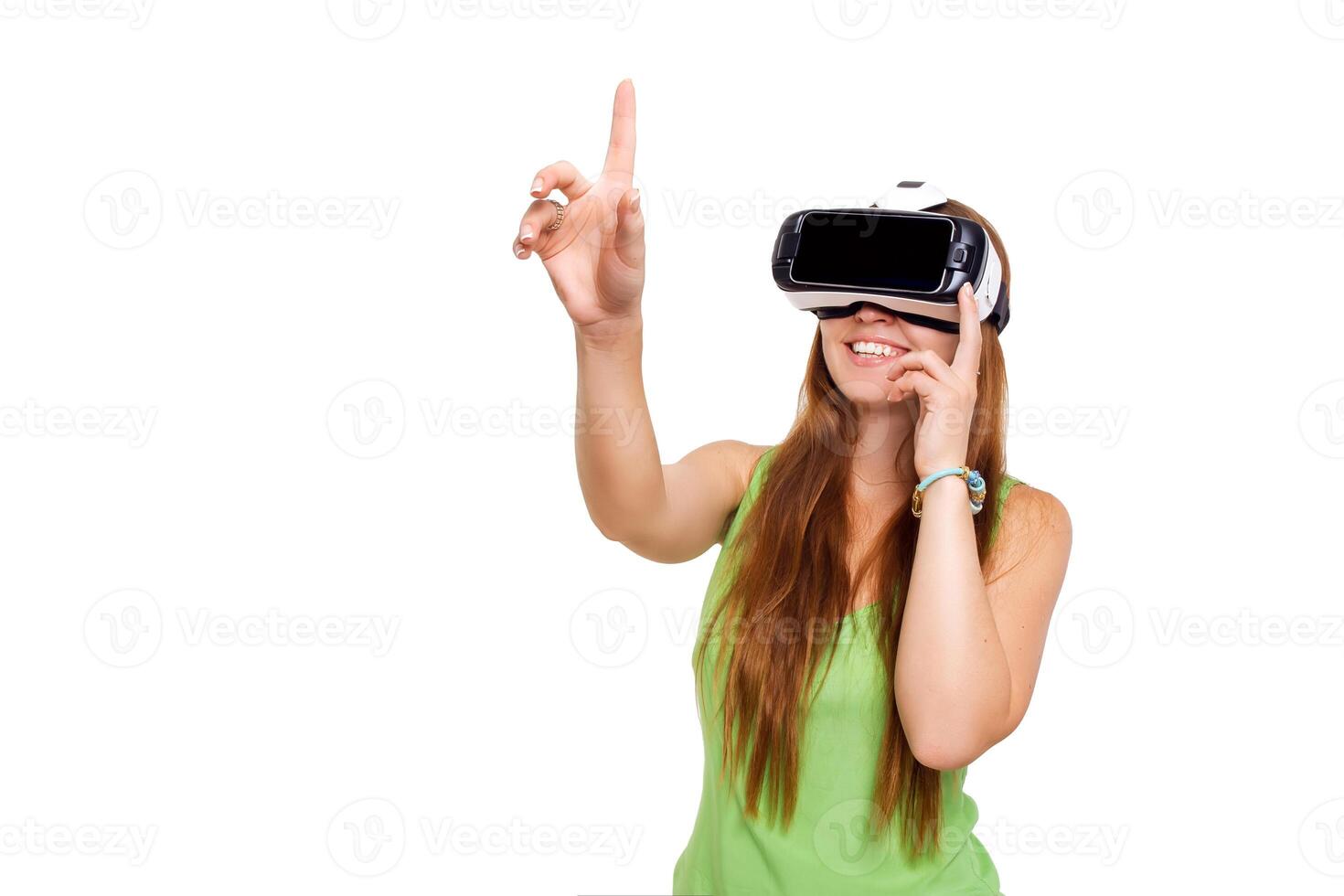 portrait of happy smiling young beautiful girl getting experience using VR-headset glasses of virtual reality isolated photo