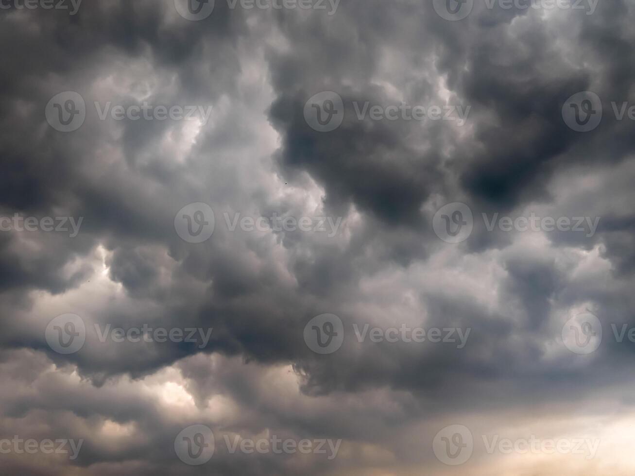 Dramatic storm clouds gathering in the sky, showcasing a powerful and moody atmosphere, ideal for weather-related themes and dramatic backgrounds. photo