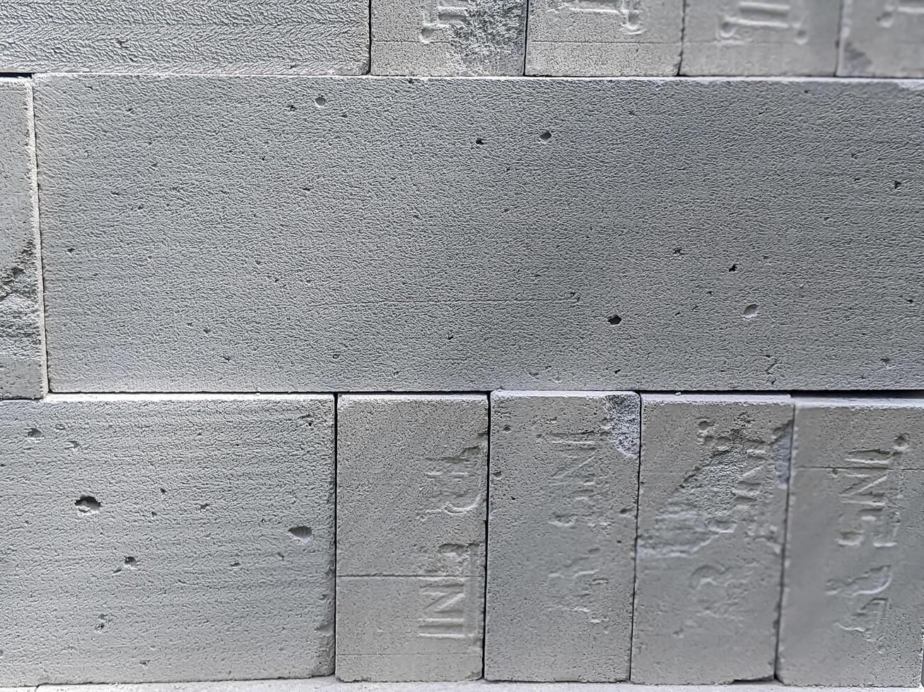 Close-up view of stacked concrete blocks showcasing distinct surface textures and small indentations on November 9, 2019 in Ciamis, Indonesia. photo