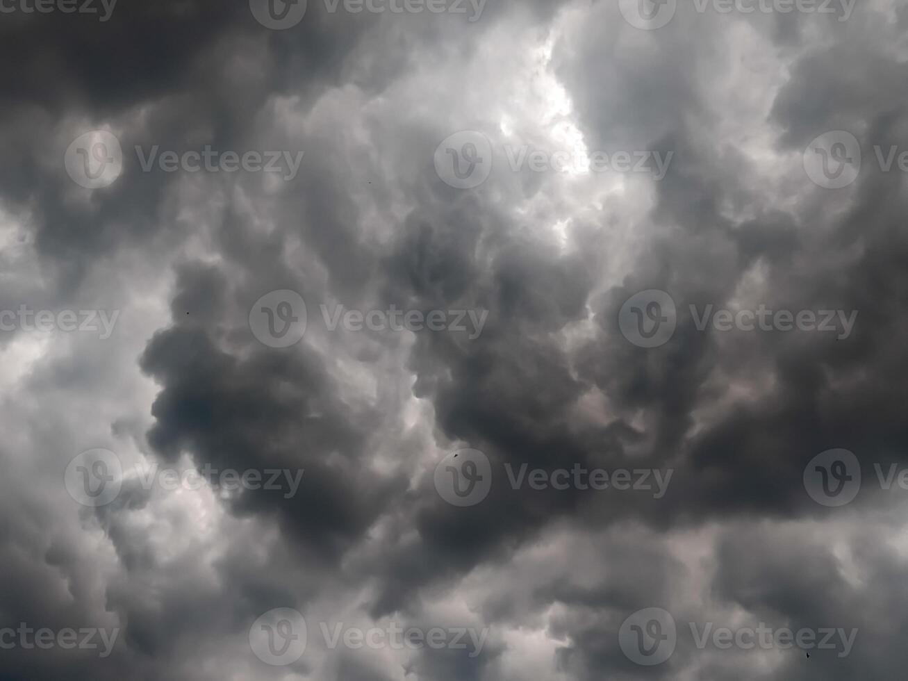 Overcast sky with dense, grey clouds, capturing the essence of an impending storm and creating a moody and atmospheric backdrop for various projects. photo