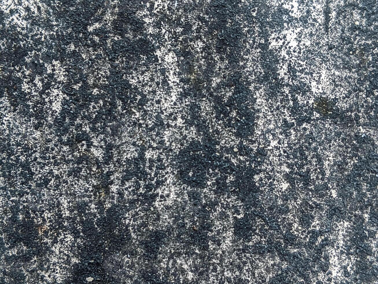 A close-up view of textured wall surfaces with black and white speckled patterns, ideal for backgrounds and architectural designs, showcasing a natural and rugged look. photo