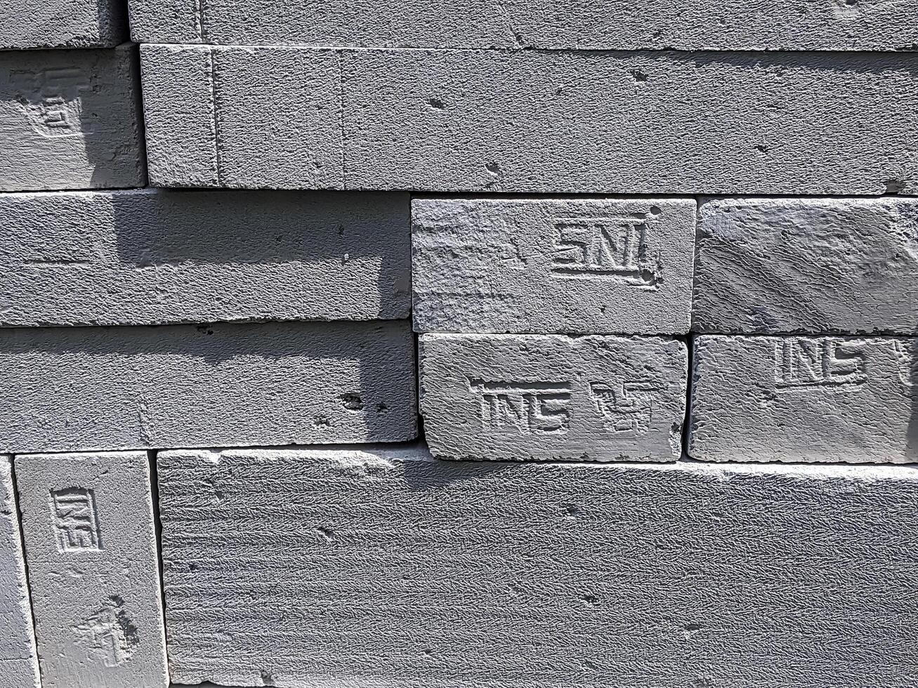 Stacks of neatly arranged concrete blocks in an outdoor setting, displaying uniform texture and size on November 9, 2019 in Ciamis, Indonesia. photo