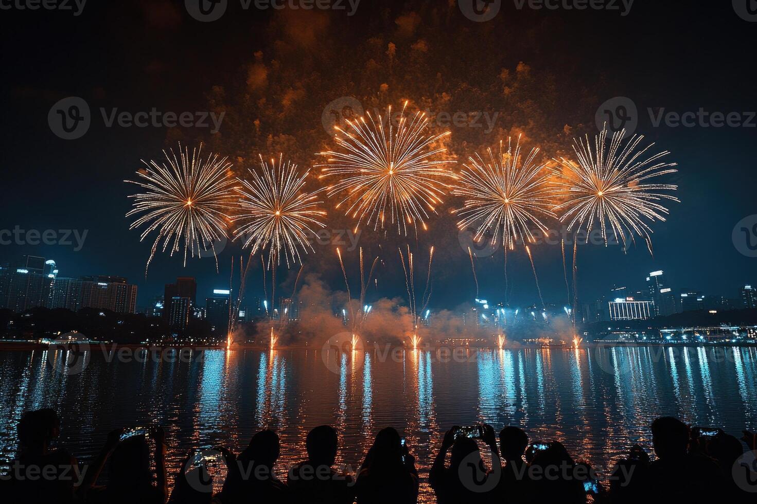 Crowd enjoying amazing colorful fireworks exploding over the city at night photo